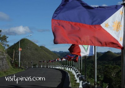 Philippine flag at the Chocolate Hills in Bohol
