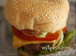 Crave Ultimate Burger (served with caramelized onions, cheese and maple bacon)