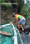 Boatman guiding boat up the rapids at Pagsanjan Falls, Laguna