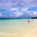 White sand, clear waters and blue sky in Boracay paradise