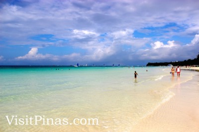 White sand, clear waters and blue sky in Boracay paradise