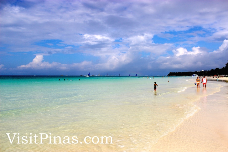 White sand, clear waters and blue sky in Boracay paradise