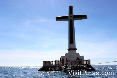 Boat docking at marker of Sunken Cemetery, Camiguin