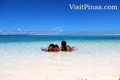 Fun under white sand, sun and clear waters at White Island, Camiguin