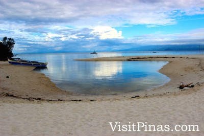 Small pond, sea, sand and sky at Mantigue (Magsaysay) Island, Camiguin