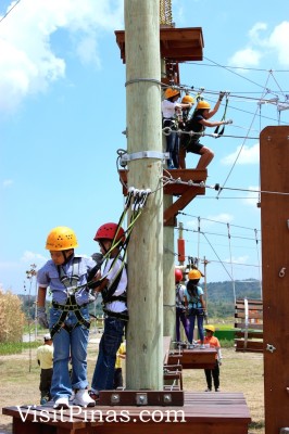 Kids strapped, waiting for adult companion at Aerial Walk (The Sandbox by Alviera)