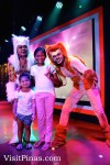 Guests posing with stage peformers at Movie Stars Cafe